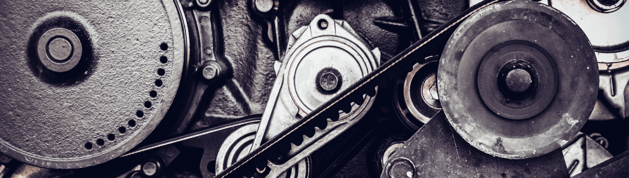 Close-up mechanical detail — gears and belt drive